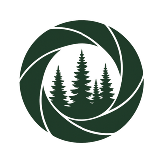 Evergreen PhotoWorks logo — evergreen trees with a camera aperture